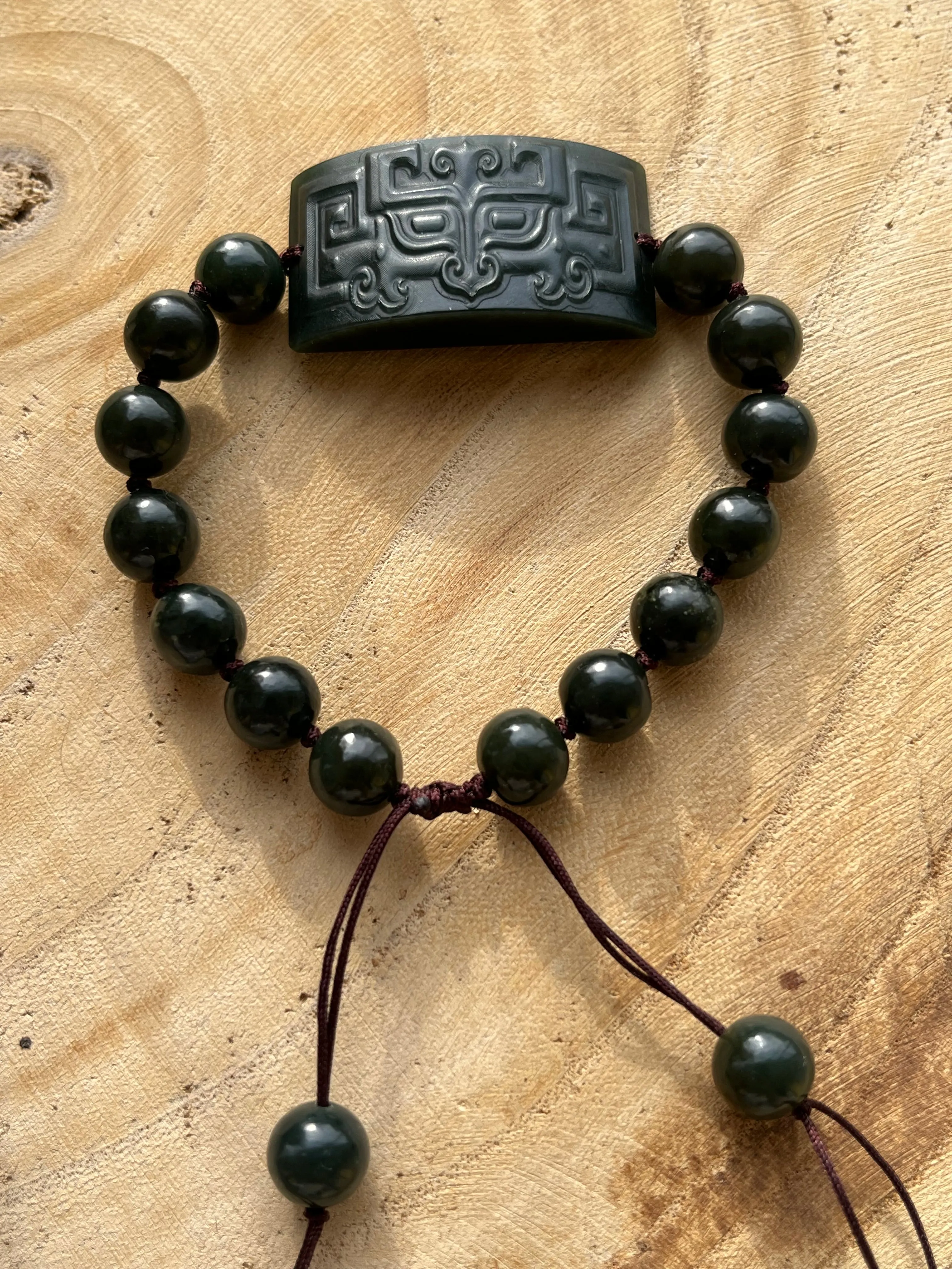 Hand-woven Bracelet with a Carved Dark Cyan Hetian Jade Beast Face Pendant and Beads (9mm)